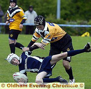 OVER YOU GO: Josh Bradbury of Saddleworth School is thrown to the ground. 