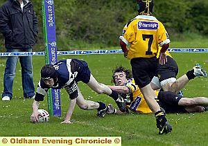 TOUCHDOWN: A despairing tackle by a Castleford High School player can’t deny a try by Chris Bolton.