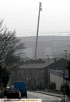 CRANE PROTEST . . . local objectors raised a crane to the proposed height of the new warehouse to show local residents the scale of the scheme CRANE PROTEST . . . local objectors raised a crane to the proposed height of the new warehouse to show local residents the scale of the scheme