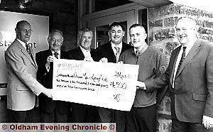 Bryan Pinder (far right), of Veolia Environmental Services, hands over the sponsorship cheque to (from left to right) Philip Hibbert, vice-president of Oldham Metro Rotary Club; Peter Mallison, past president of Saddleworth Rotary Club; Gordon Russell, of Oldham Metro Rotary Club; Martin Curtois, marketing director of Veolia, and Simon O’Connor, Veolia regional manager Bryan Pinder (far right), of Veolia Environmental Services, hands over the sponsorship cheque to (from left to right) Philip Hibbert, vice-president of Oldham Metro Rotary Club; Peter Mallison, past president of Saddleworth Rotary Club; Gordon Russell, of Oldham Metro Rotary Club; Martin Curtois, marketing director of Veolia, and Simon O’Connor, Veolia regional manager