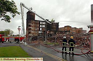 STILL damping down, firefighters at the scene of the blaze 
