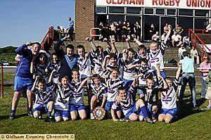 RAISE A CHEER: Saddleworth celebrate victory over Blue Coat in the Year Seven final at Manor Park. 
