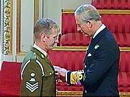 Oldham soldier Raymond Burke receives his MBE from the Prince of Wales 
