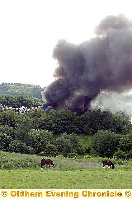 A black plume of smoke from the blaze at Broadbent Autos, as seen from Ripponden Road 