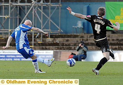 IT’S THERE: Danny Whitaker scores against Stockport County last season. Athletic kick off their campaign at home to their local rivals on Saturday, August 8. 