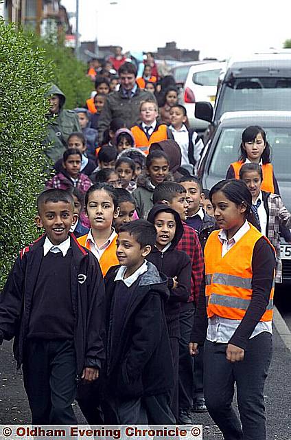 ALL aboard . . . children from Clarksfield School attempt to break the world record for the largest walking bus 