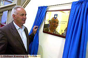 10 YEAR struggle. . . . Osman Caka reads the commemorative plaque
