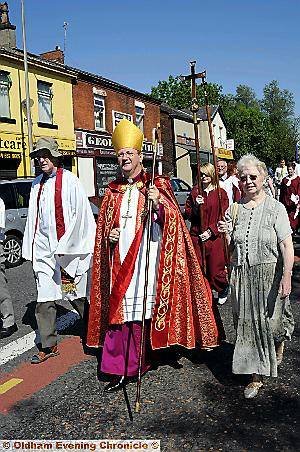 SPECIAL GUEST . . . the Right Reverend Mark Davies, Bishop of Middleton, joins walkers from St Paul’s and St Thomas’s Churches in Hathershaw