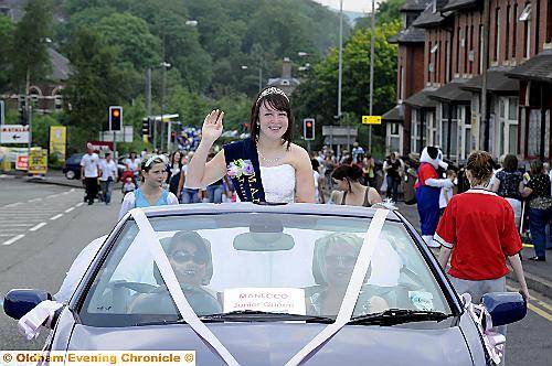 Manecco Junior Queen Aimee Burns waves to parade watchers. To buy this picture, call us on 0161 622 2130 