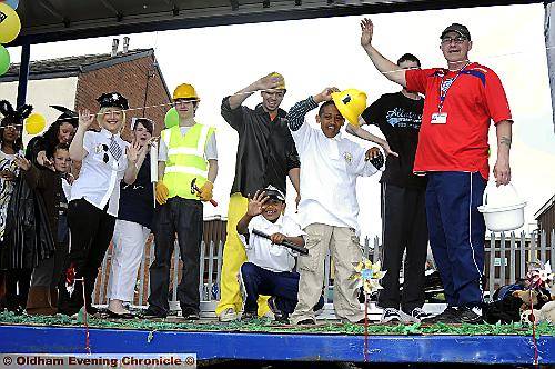 First 4 Disability's float goes by with a wave 
To buy this picture, call us on 0161 622 2130