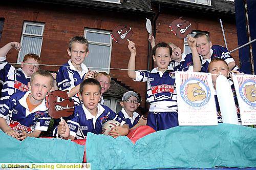 Bulldog Rugby squad enjoy the parade 
To buy this picture, call us on 0161 622 2130