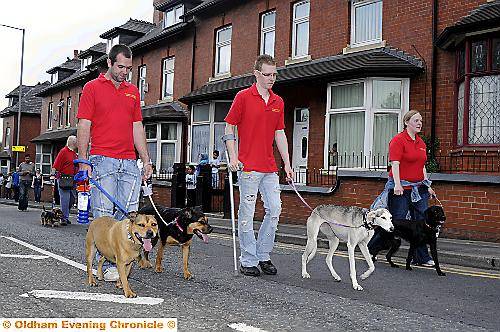 Pennine Pets handlers — and pets — enjoy a nice walkies! 
To buy this picture, call us on 0161 622 2130