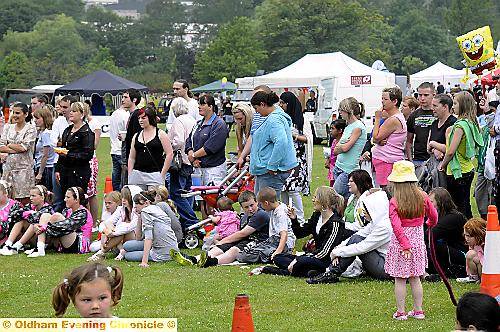 Crowds watch the dancers in the park 
To buy this picture, call us on 0161 622 2130