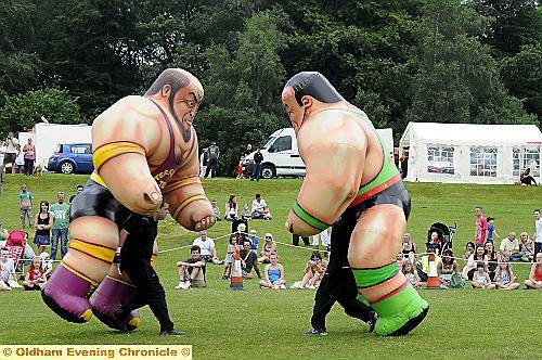 WHAT would a carnival be without Battling Cumberland Wrestlers? 
To buy this picture, call us on 0161 622 2130