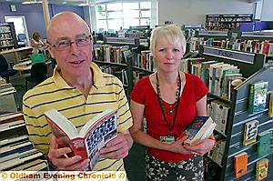 BOOK worms . . . Steven Hayton and library assistant Shelley Swallow browse the shelves BOOK worms . . . Steven Hayton and library assistant Shelley Swallow browse the shelves
