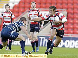 Lee Greenwood skips away from Ian Hardman to run in for his second-half try. 