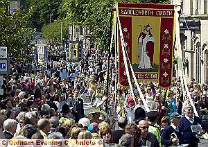 CROWDS lined the streets of Uppermill to see Saddleworth Parish Church and other congregations and brass bands parade to the playing fields 