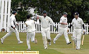 STRIKE TWO: Lee Warburton and wicketkeeper Richard Baines celebrate after Mark Hayward is dismissed first ball.  