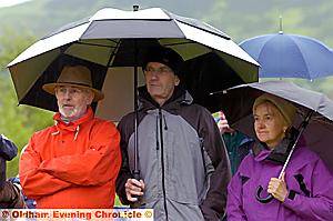 MUSIC's good, weather isn't: Spectators under umbrellas braved the rain at Diggle — and all the other outdoor contests 