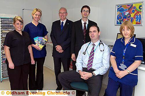 FRIENDLY faces . . . (from left) Nicole McLachlan (head dental nurse), Rebecca Hanson (dentist), Alan Higgins (director of public health for Oldham), Paul Stephens (practice manager), Dr John Patterson and Jane Cripps (nurse) 