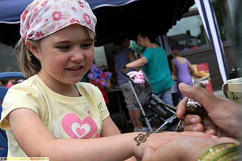 ELLA Barson (five) tried out henna painting, while (inset) Chloe Ford and Leah Roche, both 10, joined in the fun ELLA Barson (five) tried out henna painting, while (inset) Chloe Ford and Leah Roche, both 10, joined in the fun
