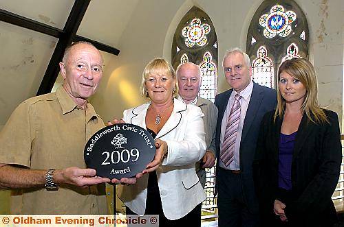 PICTURED handing over the commemorative plaque is David Makin (left), chairman of Saddleworth Civic Trust, with (left to right) Linda Davies, Talking Point managing director, David Harrison, also from the Trust, and Clive Davies and Claire Duggan, Talking Point directors. PICTURED handing over the commemorative plaque is David Makin (left), chairman of Saddleworth Civic Trust, with (left to right) Linda Davies, Talking Point managing director, David Harrison, also from the Trust, and Clive Davies and Claire Duggan, Talking Point directors.