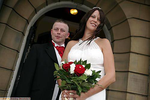 NEWLYWEDS . . . Anthony and Lisa outside Chadderton Town Hall.