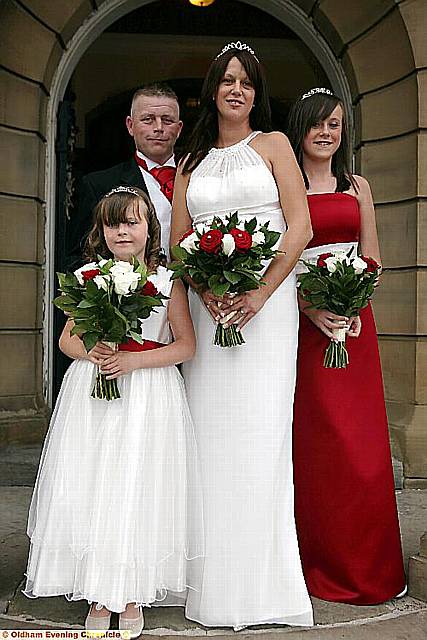 Newlyweds Anthony and Lisa Russell with their bridesmaid daughters Georgia (left) and Chloe 
