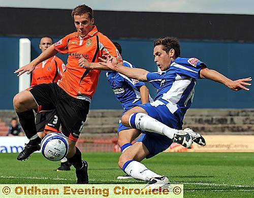ON THE STRETCH: Dean Furman, who impressed in midfield for Athletic, attempts to break the deadlock against a stubborn Stockport County outfit. 