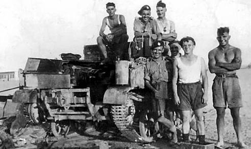 Next to a Bren carrier in north Africa, Mr Tuson is top centre and Harry Butterworth top right centre