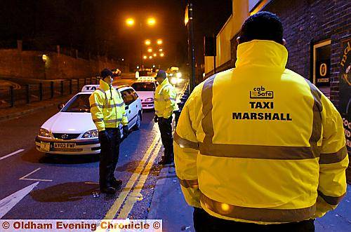REAL deal . . . Taxi marshals have their role written on their jackets. Picture: Darren Robinson