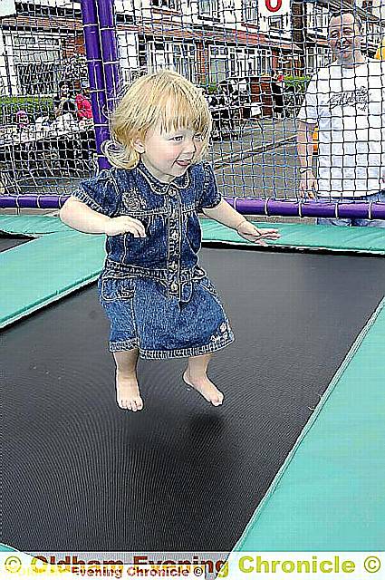 19-month-old Erin Harrison enjoys a trampoline. 