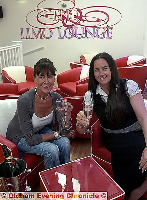 Anne (left) and Andrea toast the opening of their Limo Lounge experience. 