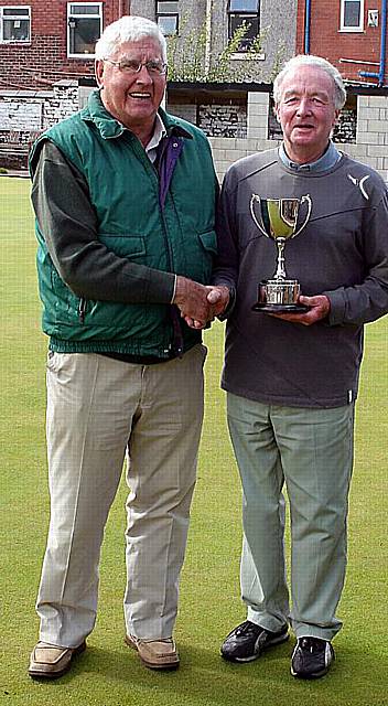 KING QUEENAN: Terry Queenan (right) receives his trophy from Failsworth League president Bill Connolly. 