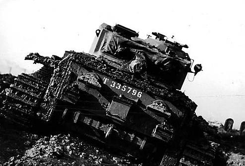 BATTLE stations . . . a tank crew in training on Oldham Edge 