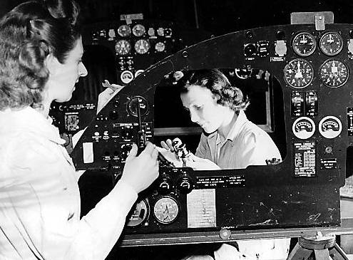 This picture from the Avro Heritage Centre shows women fitting instruments to a Lancaster control panel in the Chadderton factory 