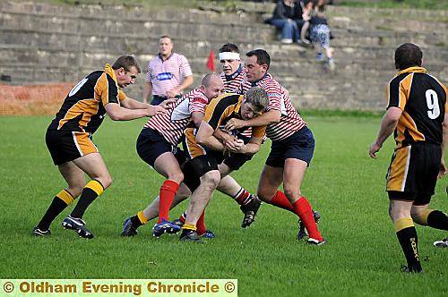 STUCK IN THE MIDDLE: Gareth Barber (left) and Guy Lovegreen stop a Didsbury attack. 