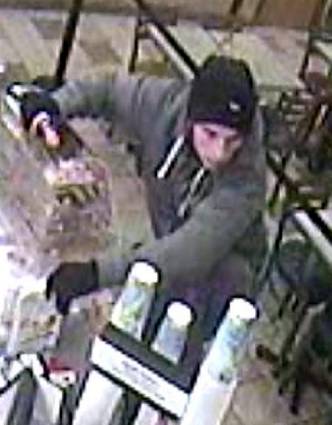 TERRIFYING . . . the robber threatens staff with a knife
TERRIFYING . . . the robber threatens staff with a knife