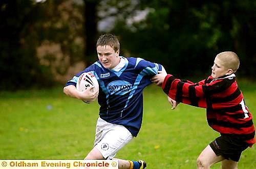 COME BACK: Charlie Fuller of Failsworth (right) gets to grips with North Chadderton’s Adam Foy. PICTURES by ANTHONY MILLER.