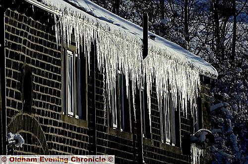 Icicles hang from the roof of a property at Globe Farm in Huddersfield Road, near Stanedge 