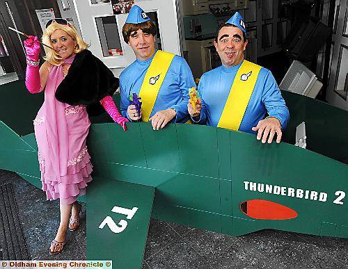 FAB efforts . . . Thunderbirds are go at Hill’s Panel Products with Julie Barrie, John Cutler and Dave Johnson dressed the part 