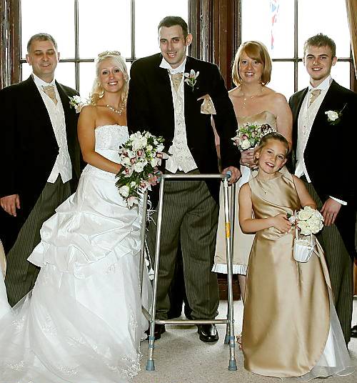 STANDING proud . . . John and Julie Power with some of the wedding party.