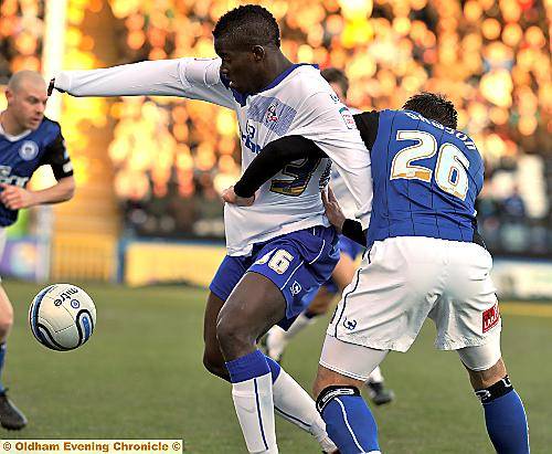 ATHLETIC frontman Oumare Tounkara (left) tangles with Rochdale defender Craig Dawson. 
