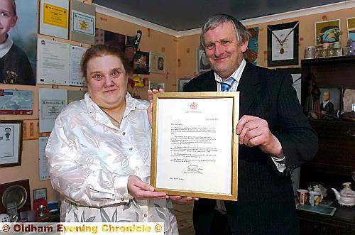 Christine and Colin Buckley and their letter from the Queen Christine and Colin Buckley and their letter from the Queen