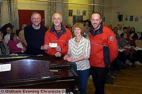 AT the presentation: (from left): Kevin Lawton, Saddleworth Musical Society chairman, Peter Hyde, Oldham Mountain Rescue Team’s treasurer and deputy leader, Hilary Rea, Diggle School music teacher, and Mick Nield, mountain rescue leader. AT the presentation: (from left): Kevin Lawton, Saddleworth Musical Society chairman, Peter Hyde, Oldham Mountain Rescue Team’s treasurer and deputy leader, Hilary Rea, Diggle School music teacher, and Mick Nield, mountain rescue leader.