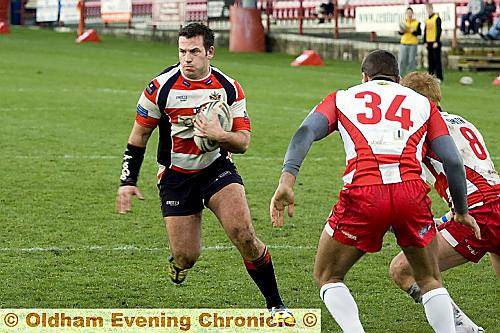 OLDHAM prop Dave Ellison looks for a gap in the Batley defence.