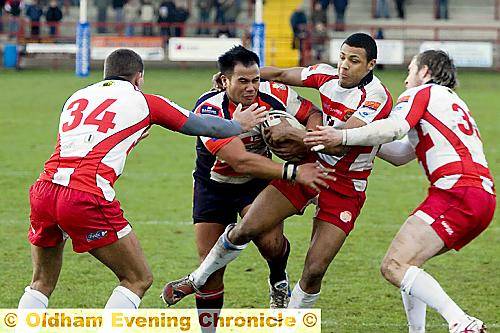 NO WAY THROUGH: Oldham new-boy Valu Bentley is surrounded by a posse of Batley Bulldogs players.