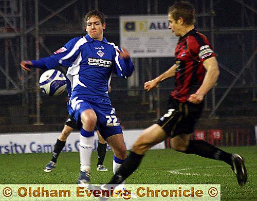 EYES ON THE BALL: Young Athletic striker Ryan Brooke closes down Millwall captain Paul Robinson.