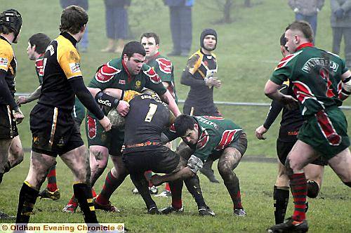STOP RIGHT THERE: Waterhead's Matthew Bland and Terry Fitzgerald stops Drighlington's Kevin Doyle in his tracks. 