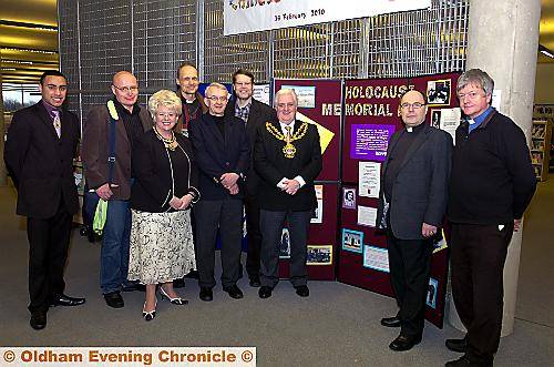 ATTENDING the Holocaust Memorial Day event at Gallery Oldham are Oldham Youth Mayor Mohammed Adil (left), the Mayoress, Councillor Kay Knox, and the Mayor, Councillor Jim McArdle (centre), five pastors from the Lutheran Church of Finland, including team leader the Rev Juhani Routasalo (second right), and Oldham Interfaith Forum chairman, the Rev Howard Sutcliffe (right). 